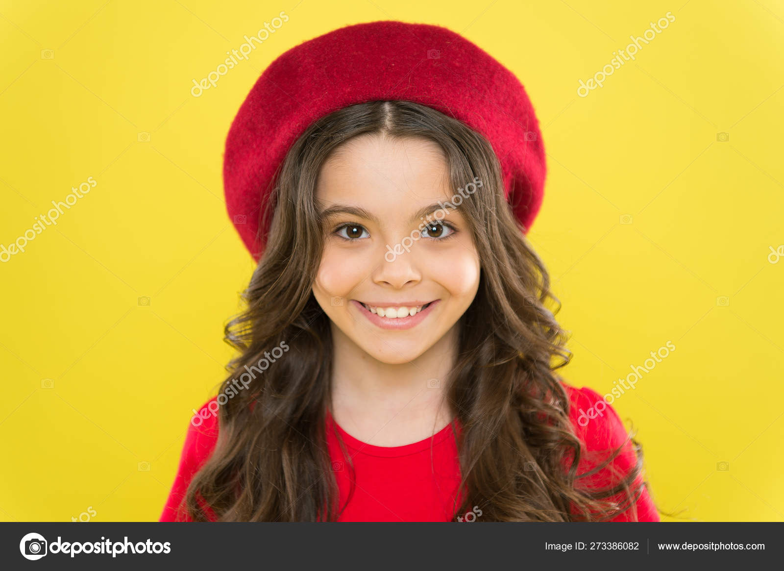 Perfect curls. Kid cute face with adorable curly hairstyle wear beret hat. Little fashionista. Little girl grow long hair. Styling of curly hair. Hairdresser service. Kid girl long healthy shiny hair Stock Perfect curls. Kid cute face with adorable curly hairstyle wear beret hat. Little fashionista. Little girl grow long hair. Styling of curly hair. Hairdresser service. Kid girl long healthy shiny hair Stock