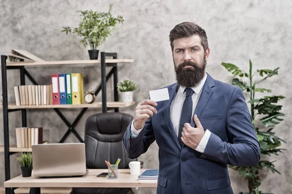 Banking services for small business. Card design. Call now. Guy formal suit stand in office. Accountant or banker. Businessman hold blank card. Useful contacts. Bearded hipster top manager show card — Stock Photo, Image