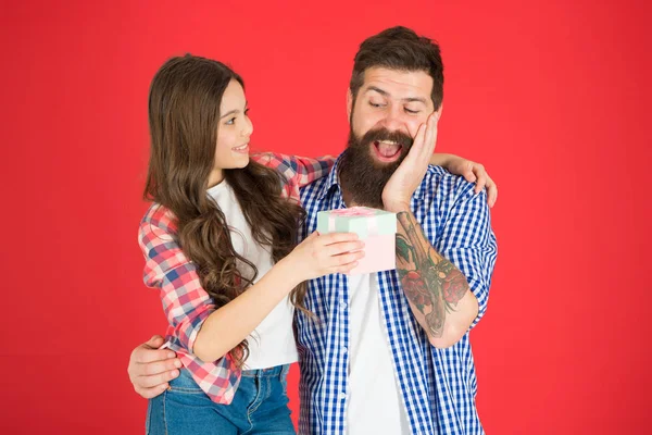 For best dad ever. Celebrate fathers day. Family values concept. Friendly relations. Father hipster and his daughter. Gift surprise. Man bearded father and cute little girl daughter on red background — Stock Photo, Image