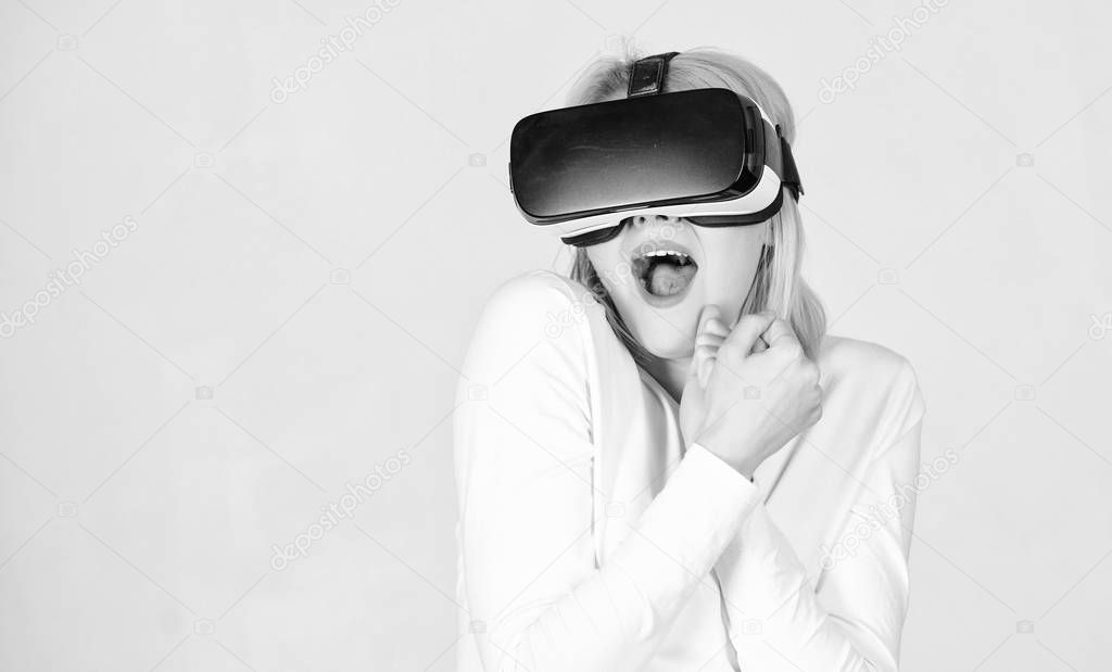 A person in virtual glasses flies in room space. Woman with virtual reality headset. Woman enjoying cyber fun experience in vr. A virtual reality.