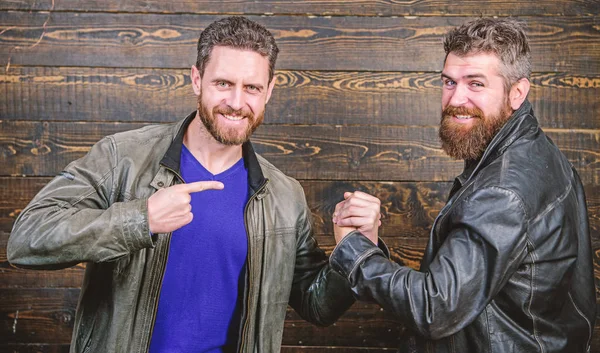 Handshake symbol of successful deal. Approved business deal. Handshake gesture meaning. Have agreed. Brutal bearded men wear leather jackets shaking hands. Strong handshake. Friendship of brutal guys — Stock Photo, Image