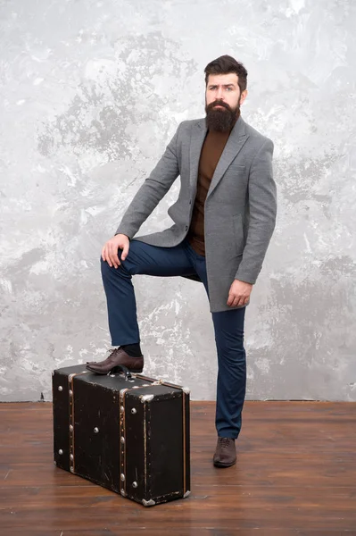 Time traveller concept. Vintage inspired design of bag. Retro and vintage. Fashion trend. Accessories for vacation. Best travel bags for men. Guy well groomed elegant bearded man and vintage suitcase