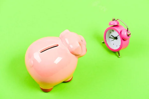 Financial crisis. Economics and finance. Banking account. Bankruptcy and debt. Pay for debt. Bank collector service. Credit debt. It is time to pay. Piggy bank pink pig and little alarm clock — Stock Photo, Image