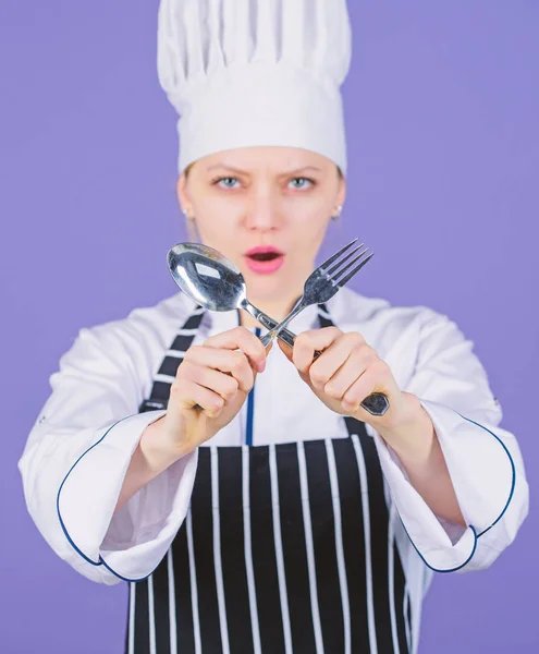 Appetite and taste. Traditional culinary. Professional cook of culinary school. Culinary arts academy. Culinary school concept. Woman professional chef hold utensil spoon and fork. Time to eat