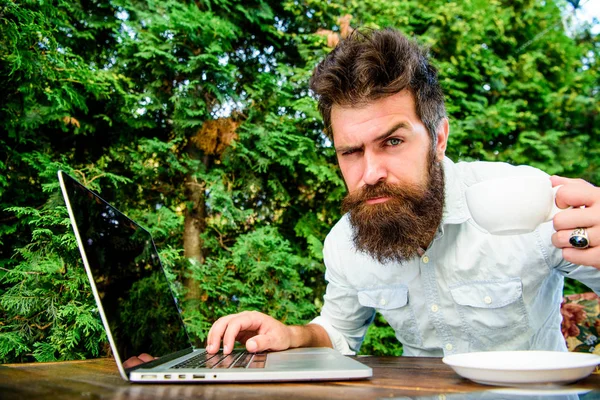Caffeine booster for productivity. Online blog. Blogger freelance editor. Workaholic stereotype. Drink coffee work faster. Bearded man freelance worker. Remote job. Freelance professional occupation