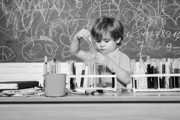 Practical knowledge concept. Study grants and scholarship. Wunderkind and early development. Smart children performing chemistry test. Small pupil learning chemistry in school. Chemistry laboratory — Stock Photo, Image