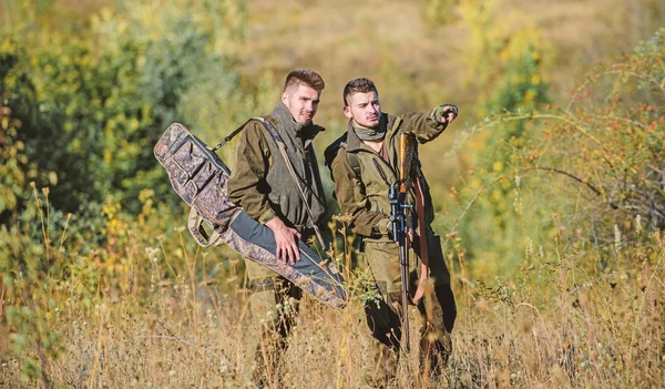 Hunters with rifles in nature environment. Poacher partner in crime. Activity for real men concept. Hunters gamekeepers looking for animal or bird. Illegal hunting. Hunters friends enjoy leisure — Stock Photo, Image