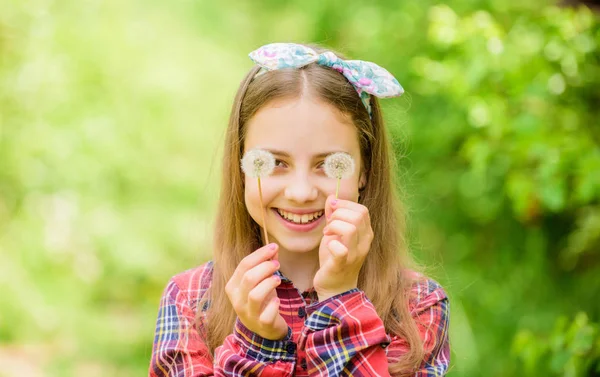 Summer is here. Summer garden flower. Girl teen dressed country rustic style checkered shirt nature background. Make a wish. Celebrating return of summer. Dandelion is beautiful and full of symbolism