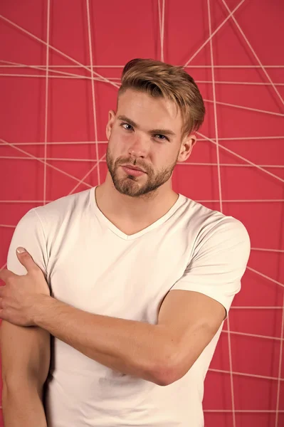 Man bearded guy modern hairstyle in pensive mood pink background. Simple hacks to make hairstyle better. Use right product styling hair. Confident with tidy hairstyle. Barber hairstyle tips