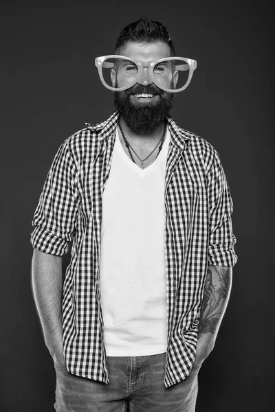 Stay positive. Man brutal bearded hipster wear funny eyeglasses accessory. Human strengths and virtues. Positive mood. Positive psychology. Overcome life troubles with smile. Happiness and positive