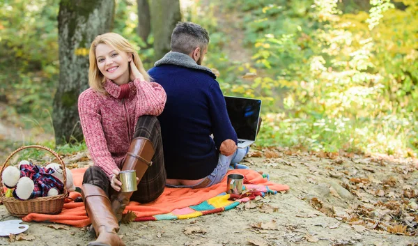 Working on fresh air. Happy loving couple relaxing in park with laptop. Always at work. Man freelance worker internet addicted gamer with laptop forest. Internet addicted husband. Surfing internet