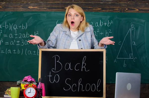 School. Home schooling. surprised woman. teacher with alarm clock. Time. Study and education. Modern school. Knowledge day. Back to school. Teachers day. woman in classroom. Student on exam