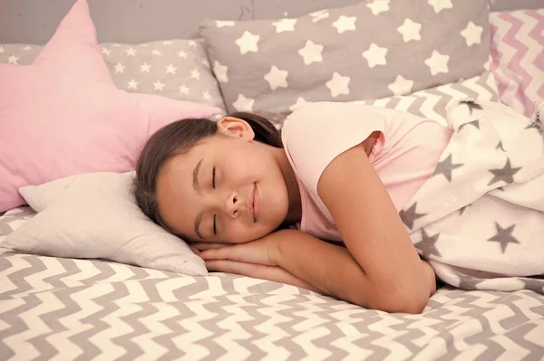 Girl child fall asleep on pillow. Quality of sleep depends on many factors. Choose proper pillow to sleep well. Girl lay on pillow bedclothes background. Child having nap. Cute badclothes and pillows — Stock Photo, Image