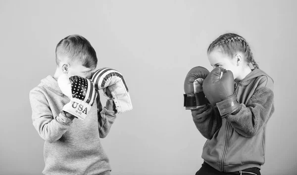 Happy children in boxing gloves. Fitness diet. energy health. punching knockout. activity. Sport success. Friendship fight. workout of small girl and boy boxer in sportswear. Striking the pose — Stock Photo, Image