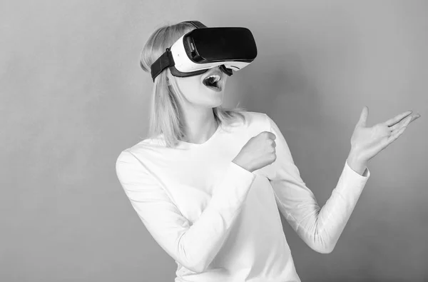 Young woman using a virtual reality headset with conceptual network lines. Woman using VR device. The woman with glasses of virtual reality. VR.