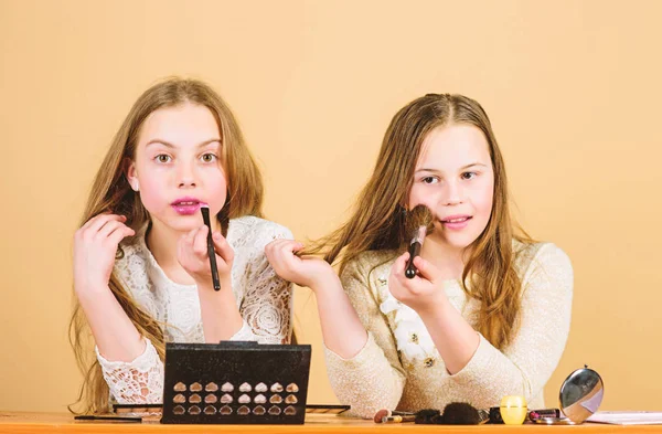 Children little girls choose cosmetics. Makeup store. Experimenting with style. Makeup art. Explore cosmetics bag concept. Salon and beauty treatment. Just like playing with makeup. Makeup courses