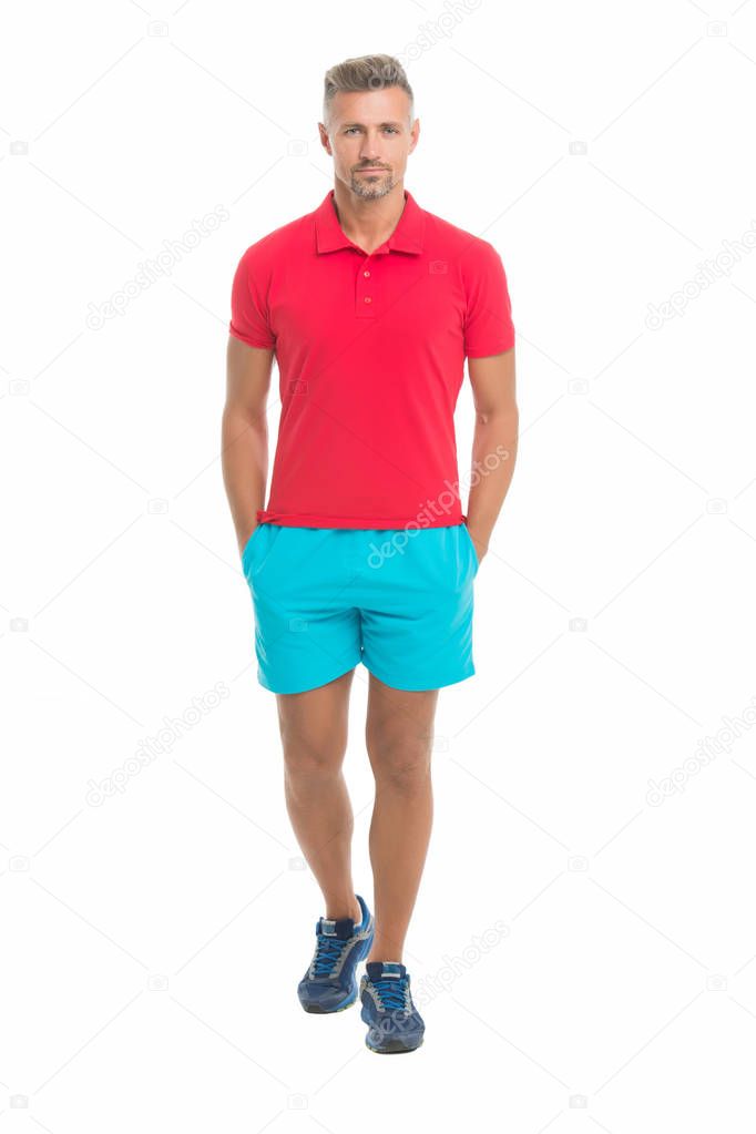 Sport style. Menswear and fashionable clothing. Man calm face posing confidently white background. Man looks handsome in shirt and shorts. Guy sport outfit. Fashion concept. Man model clothes shop