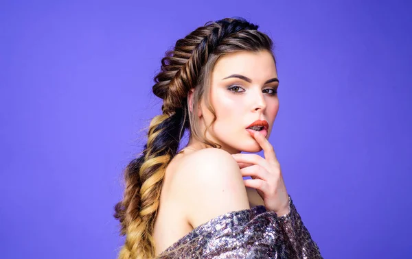 French braid. Professional hair care and creating hairstyle. Braided hairstyle. Beautiful young woman with modern hairstyle. Beauty salon hairdresser art. Girl makeup face braided long hair