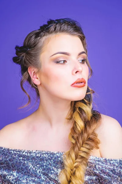 Braided hairstyle. Girl makeup face braided long hair. French braid. Professional hair care and creating hairstyle. Beauty salon hairdresser art. Beautiful young woman with modern hairstyle