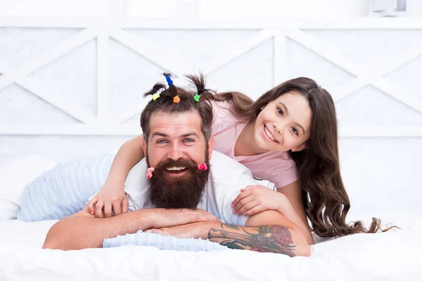 Happy moment. Raising girl. Create funny hairstyle. Child making hairstyle styling father beard. Being parent means present for kid interests. Change hairstyle. Daughter hairstylist. Enjoy fatherhood