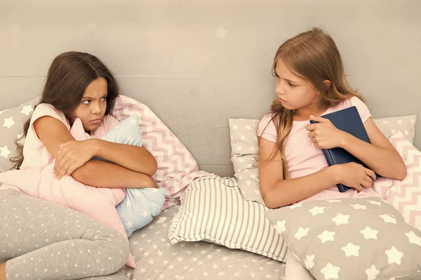 She dont want to share her book. Sisters rivalry concept. Sisters relations issues. Share book with friend. Children in bedroom want read evening fairy tale. This is my book. Girlish rivalry — Stock Photo, Image