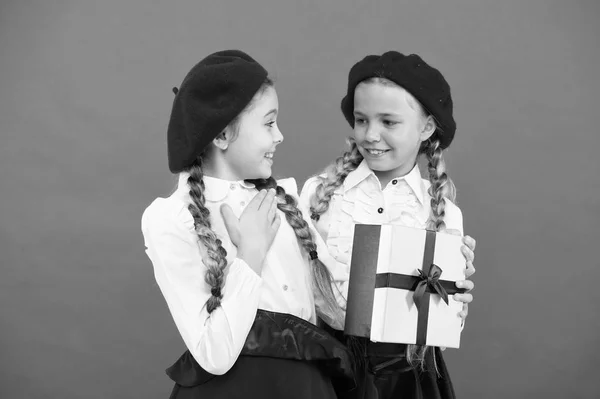 Girl giving gift box to friend. Girls friends celebrate holiday. Children formal wear with gift box. Open gift now. Friendship concept. Birthday present. Shopping and holidays. For my dear friend — Stock Photo, Image