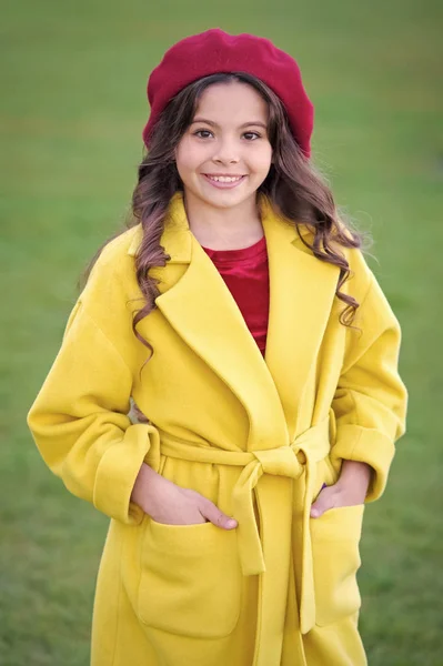 Charming french style fashionable girl. Fall fashion concept. Hat accessory french fashion detail. Kid girl bright hat beret long curly hair. Fall hat fashion accessory. French trend fall season