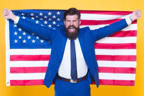 American by birth. Rebel by choice. Confident businessman handsome bearded man in formal suit hold flag USA. Successful businessman well groomed appearance. Business people. Businessman concept — Stock Photo, Image