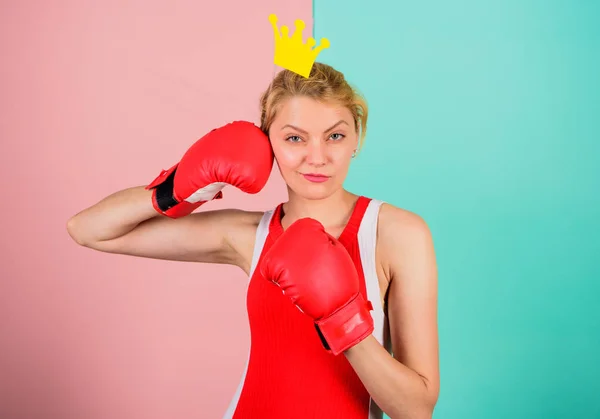 Queen of sport. Become best in boxing sport. Feminine tender blonde with queen crown wear boxing gloves. Fight for success. VIP gym. Fighting queen. Woman boxing glove and crown symbol of princess