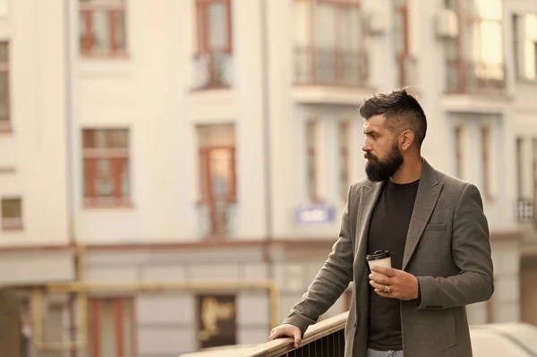 One more sip of coffee. Enjoying coffee on the go. Businessman well groomed appearance enjoy coffee break out of business center. Relax and recharge. Man bearded hipster drinking coffee paper cup — Stock Photo, Image