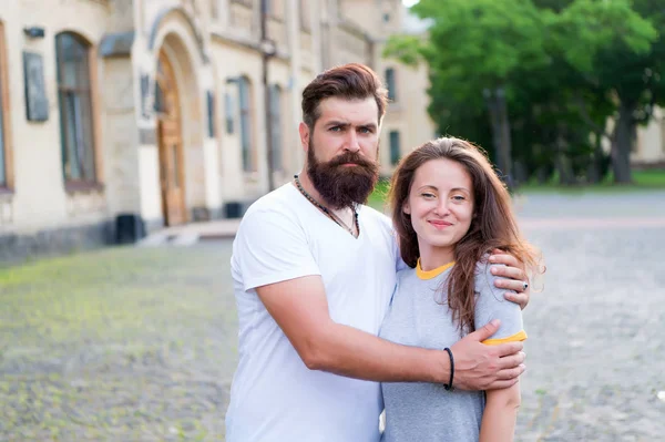 Enjoying togetherness. Couple in love. Couple of bearded man and sexy woman. Family couple hugging on summer outdoor. Sensual couple spending time together