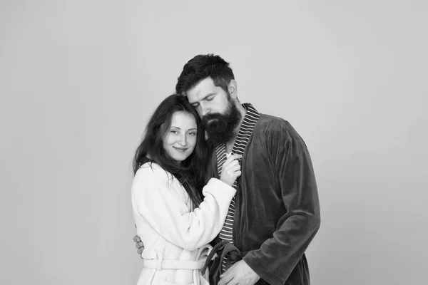 Sleepy man embrace his girl. Bearded man and woman in robe pajama. Couple in love. sleepy family. Wake up morning. Love and romance. Happy family in morning. couple looks sleepy in morning. Insomnia