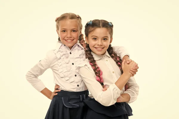 Childrens day. Back to school. Childhood happiness. Friendship and sisterhood. small girl children with perfect hair. small kid fashion. Happy little sisters. Beauty fashion. Together since school — Stock Photo, Image