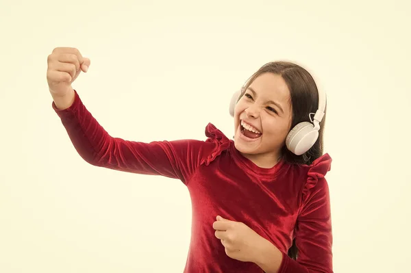 Little girl listen music wireless headphones. Online music channel. Girl little child use music modern headphones. Music always with me. Listen for free new and upcoming popular songs right now