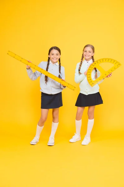 School friendship. School day fun cheerful moments. Kids cute students. Knowledge day. Schoolgirls best friends excellent pupils. Secondary school. Schoolgirls tidy appearance school uniform — Stock Photo, Image