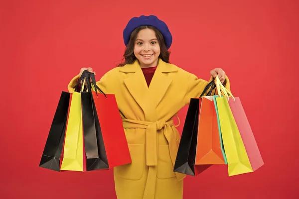 Fashionista enjoy shopping. Customer satisfaction. Prime time buy spring clothing. Obsessed with shopping. Girl cute kid hold shopping bags. Get discount shopping on birthday holiday. Nice purchase