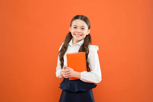 Kid school uniform hold workbook. School lesson. Child doing homework. Believe in possibilities. Inspiration for study. Back to school. Knowledge day. Possible everything. Schoolgirl enjoy study — Stock Photo, Image