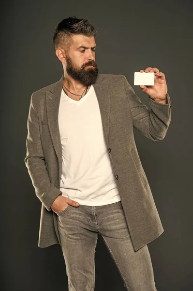 Plastic bank card. Easy money credit. Which bank card easy to get. Easy shopping. Credit card gives you freedom and confidence. Man bearded hipster hold plastic blank card. Banking and credit concept