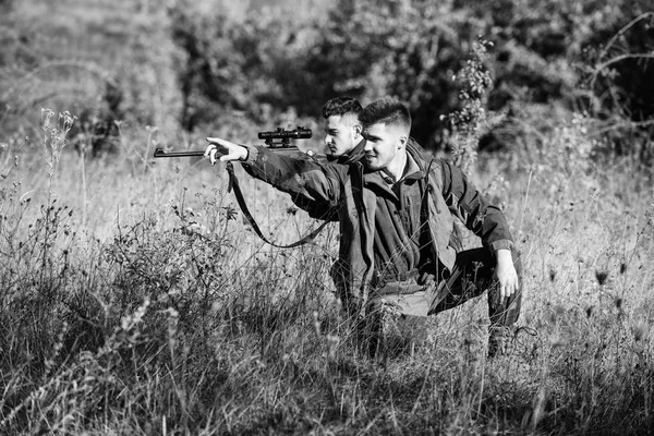 Hobby for real men concept. Hunters with rifles in nature environment. Hunter friend enjoy leisure in field. Hunters gamekeepers looking for animal or bird. Hunting with friends hobby leisure — Stock Photo, Image