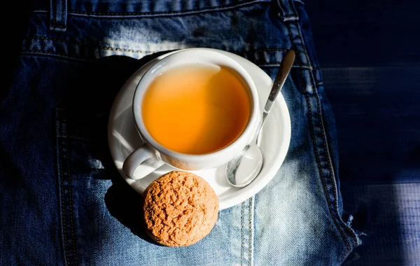 Quick snack concept. Relaxing chamomile tea. Cup mug hot tea and oat cookie. Mug filled tea close up. Herbal green or black whole leaf. Process tea brewing ceramic mug. Inspiration and peaceful mood — Stock Photo, Image