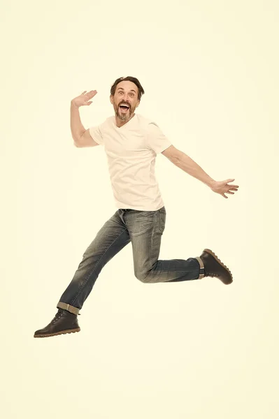 Free jumping. Having fun. Mature man jumping in fun. Funny man. Mature man of fashion with grey beard. Bearded senior man fit to modern fun. Mature fashion model in casual wear. Time for fun — Stock Photo, Image