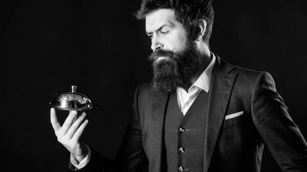 Elite luxurious. Secret under cloche. Exclusive food hidden cloche. Here is your meal. Something special. Man well groomed bearded gentleman formal suit hold little cloche. Serving and presentation