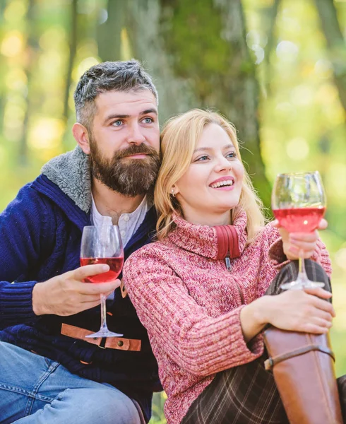 This should be fine. happy woman and bearded man drink wine. Family picnic. Valentines day. camping and hiking. cheers. couple in love relax in autumn forest. love date and romance. Spring mood