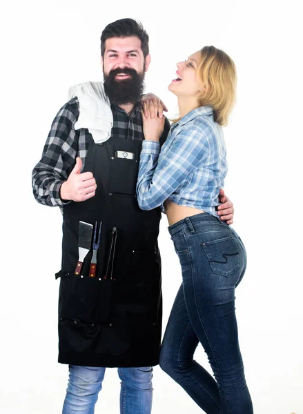 Man bearded hipster and girl. Preparation culinary. Couple in love hold kitchen utensils. Tools for roasting. Picnic barbecue. food cooking recipe. Family weekend. Recipe requires a lot of loving