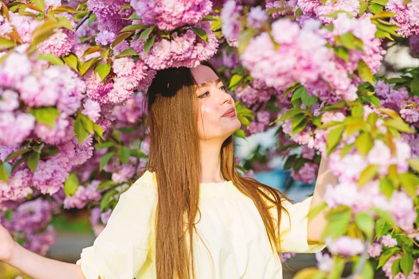 skincare and spa. Natural cosmetics for skin. woman in spring flower bloom. girl in cherry flower. Sakura tree blooming. blossom smell, allergy. natural summer beauty. Wonderful smell