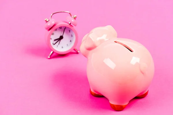 time is running out. time is money. Economy and budget increase. success in finance commerce. retirement. family budget. business startup. financial position. piggy bank with alarm clock. Moneybox