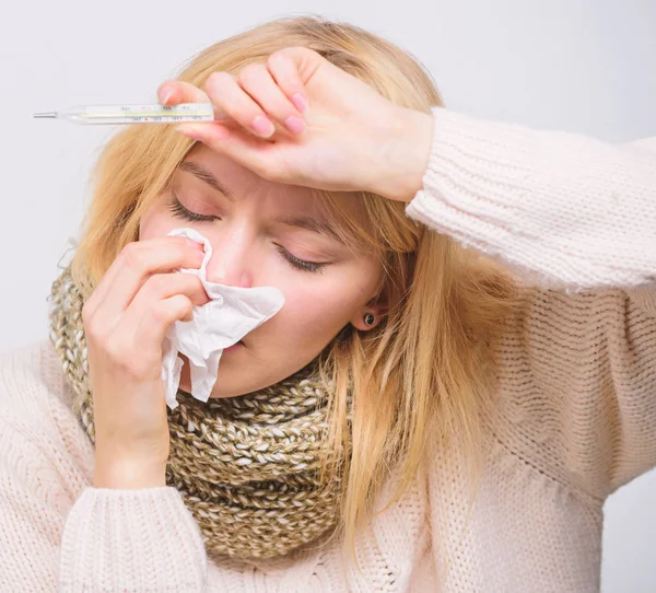 Measure temperature. Break fever remedies. Seasonal flu concept. Woman feels badly. Fever symptoms and causes. Sick girl with fever. How to bring fever down. Girl sick hold thermometer and tissue