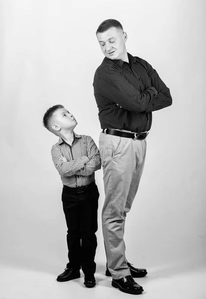 father and son in business suit. happy child with father. business partner. family day. childhood. father and son concept. parenting. fathers day. little boy with dad businessman. father and son