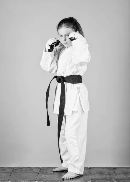 Knockout. energy and activity for kids. small girl in martial arts uniform. practicing Kung Fu. happy childhood. sport success in single combat. little girl in gi sportswear. I am ready to fight — Stock Photo, Image