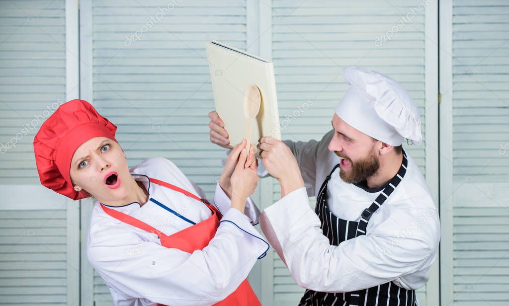 who is in charge of the kitchen. couple in love with perfect food. man and woman chef. Family cooking in kitchen. secret ingredient by recipe. cook uniform. Menu planning. culinary cuisine